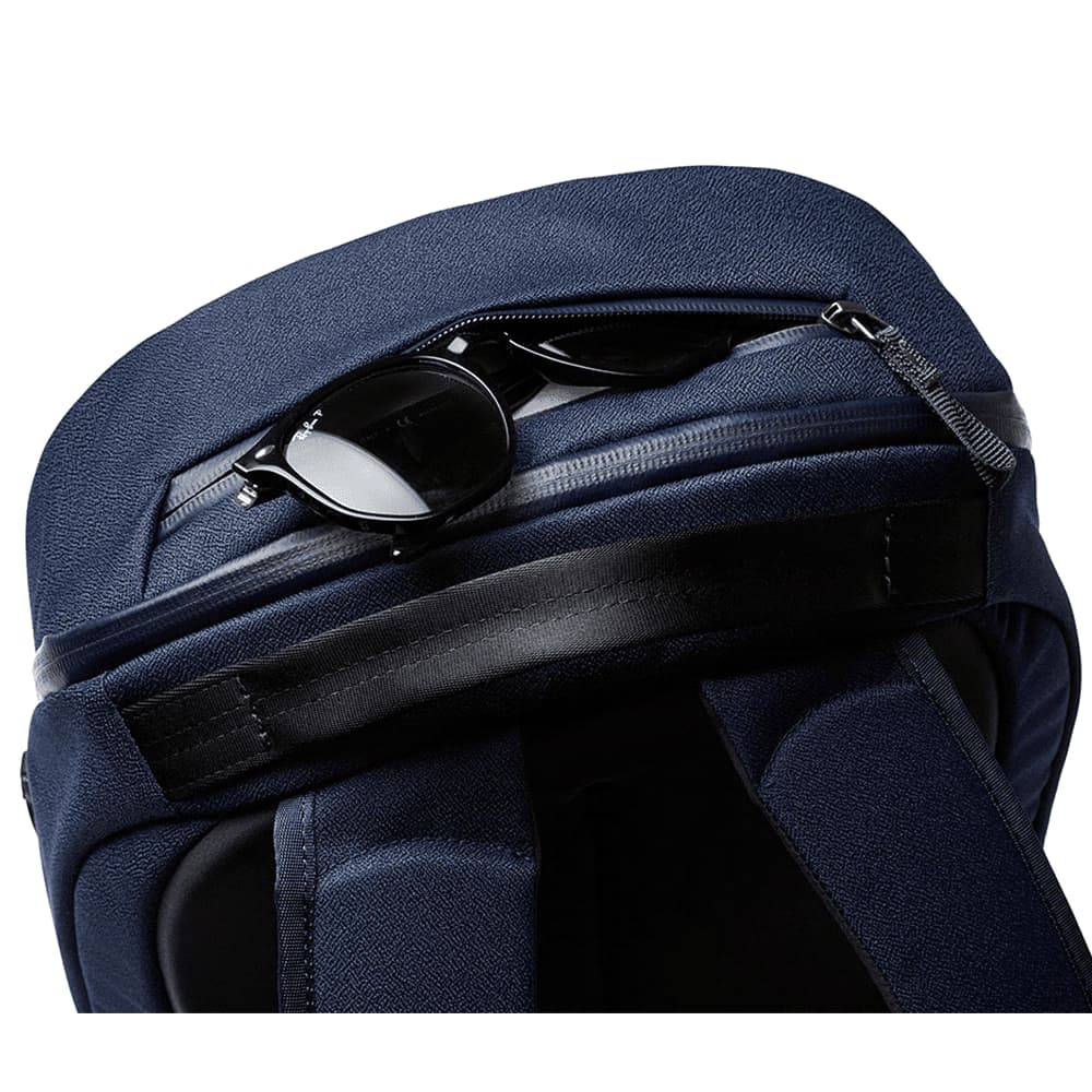 A black 20L backpack with padded shoulder straps and a sleek design, featuring a logo on the back.