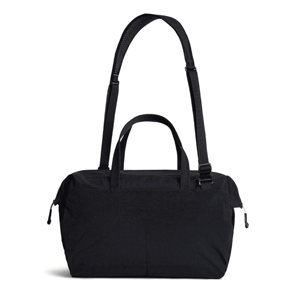A black duffel bag with a detachable strap and dual handles, featuring a logo on the front.
