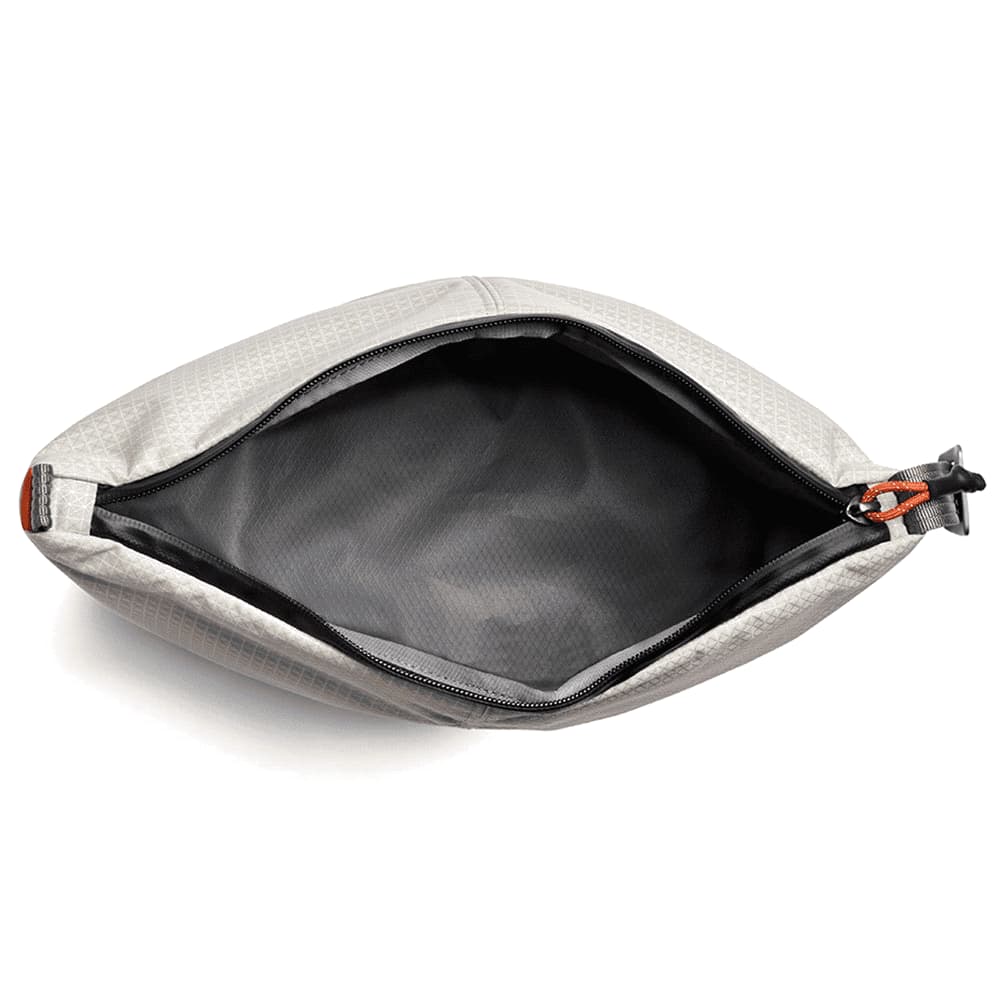 A grey cooler bag with a textured surface and a black zipper, featuring an orange pull tab. It has a logo on it.