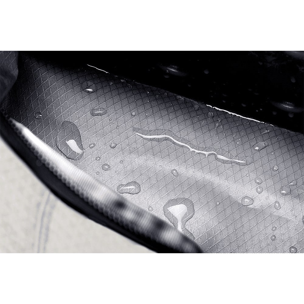 A drink bottle is being secured with a grey strap and clip, designed for use with the Bellroy Lite Cooler Caddy 10L.