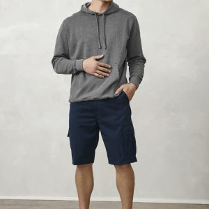 A model stands wearing grey hoodie and navy dress shorts with pockets, complemented by black sneakers.