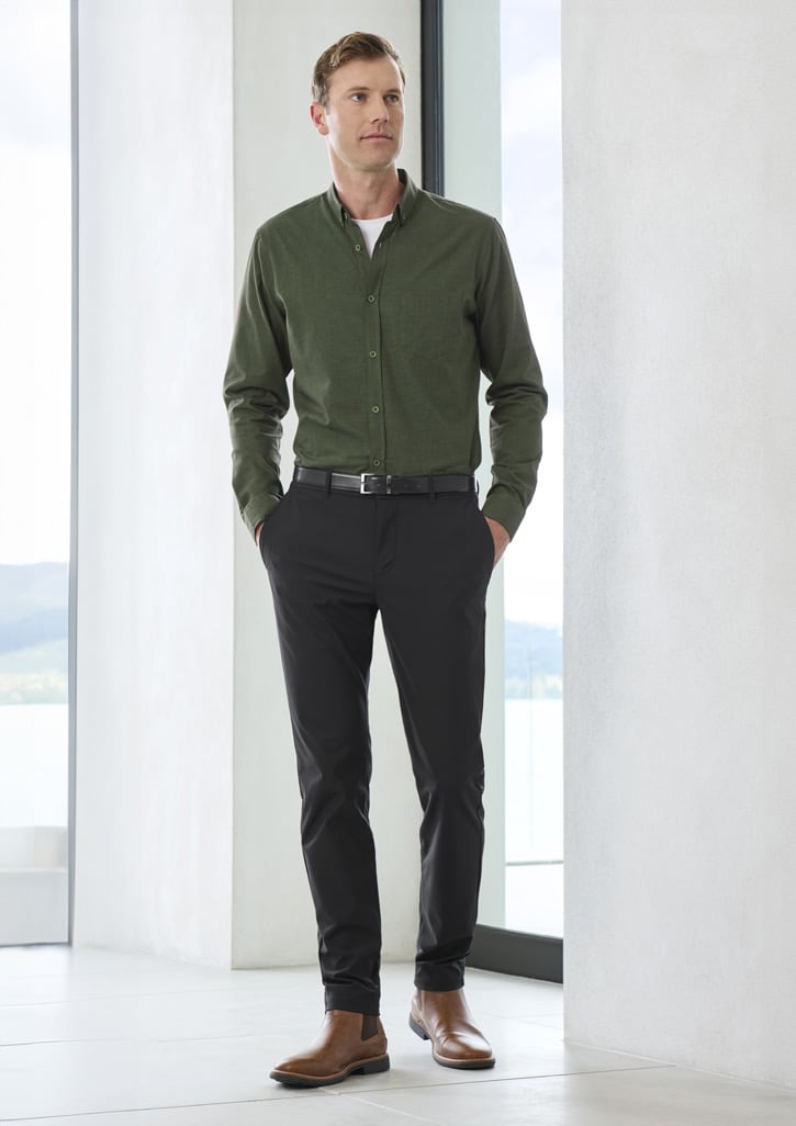 A pair of black men's venture pants displayed on a model, paired with a green shirt and brown shoes.