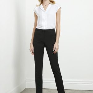 A model wearing black women's slacks paired with a white blouse, standing against a plain background.