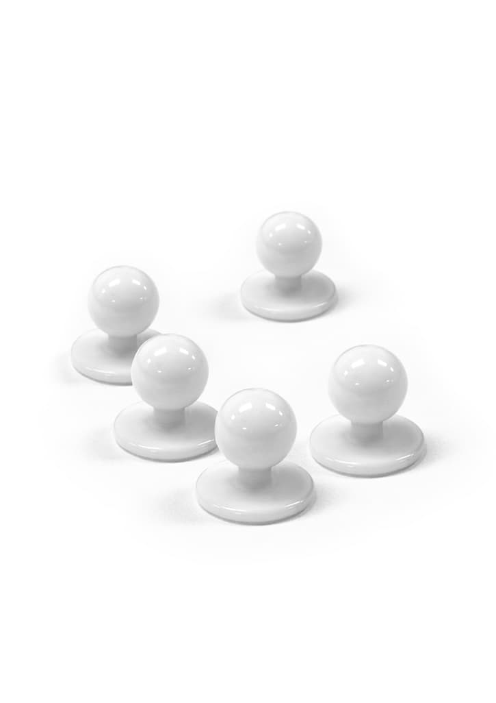 A set of five white chef jacket buttons displayed on a plain background.
