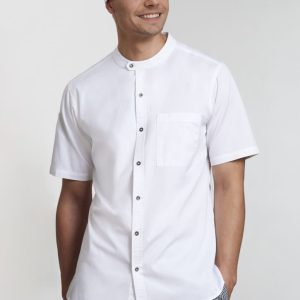 A white short sleeve chef shirt with a pocket, styled with a matching chef hat and checkered pants.