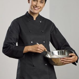 A black long sleeve chef jacket worn by a woman, who is holding a mixing bowl and whisk. The outfit includes a chef's hat.