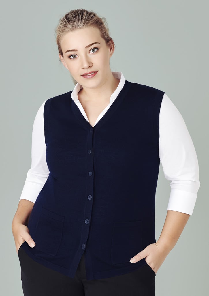 A navy blue women's button front knit vest featuring a v-neck and front pockets, paired with a white shirt.
