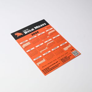 A magnetic calendar for 2024 featuring a bold orange design and a logo, with various monthly layouts.