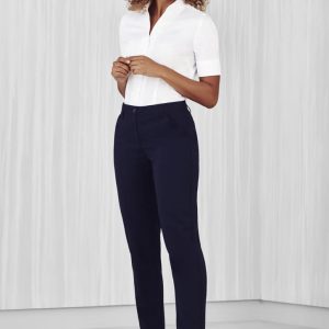 A pair of women's navy slim leg pants with a comfort waist, styled with a white shirt and casual shoes.