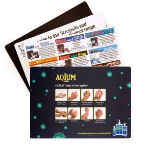 A counter mat featuring multiple designs, including hygiene steps, with a black and colourful background. It has branding.