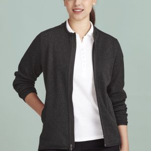 A women's zip front jumper in dark grey with a zip closure and long sleeves, paired with a white polo shirt.