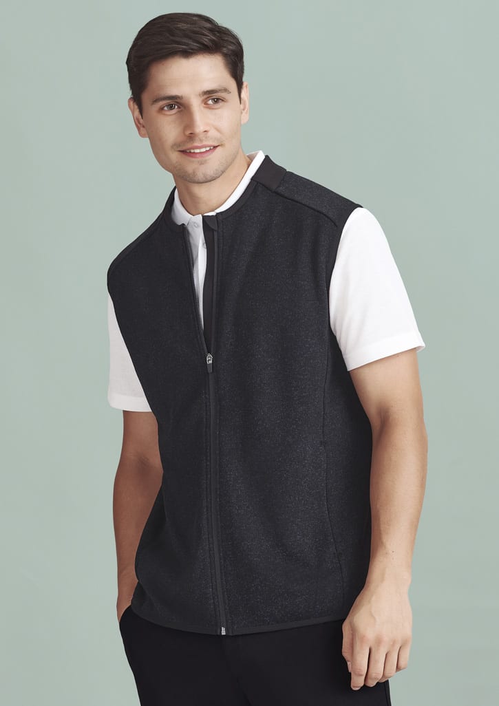 A men's black zip-front vest over a white shirt. The vest features a logo on the chest.