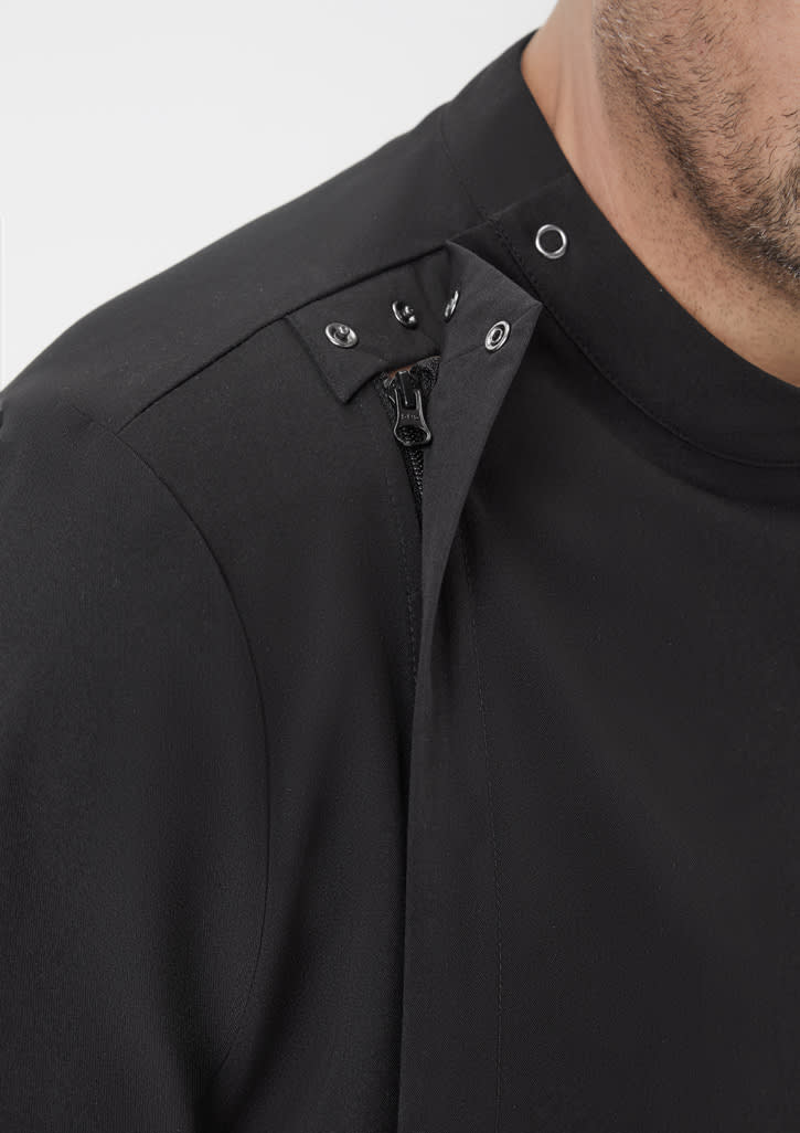 A close-up of a black men's jacket featuring snap buttons and a zip detail on the shoulder.