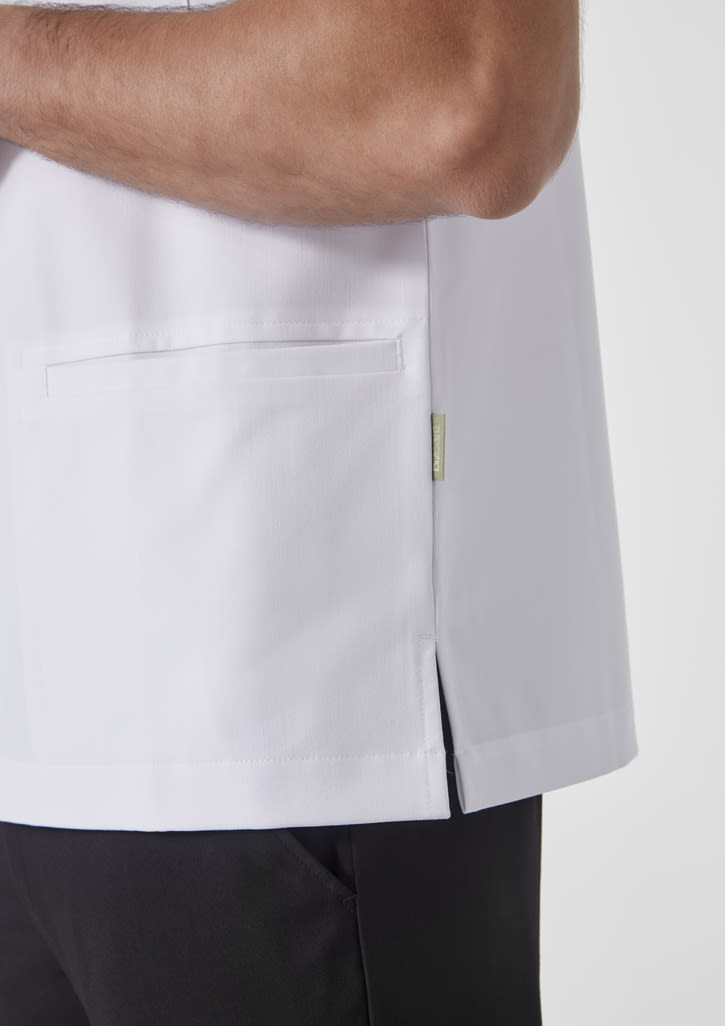 A white jacket with a side pocket and logo, featuring a straight hem, worn with black pants.