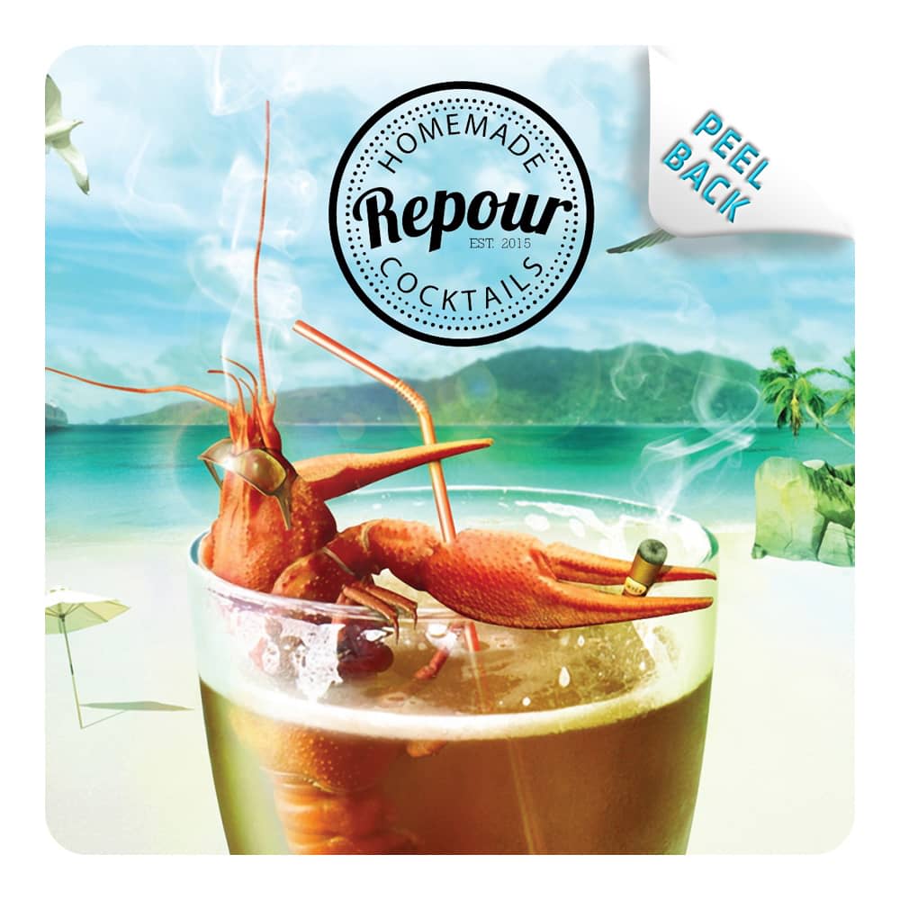 A colourful cocktail with a shrimp garnish rests on a beach-themed coaster featuring a logo and branding.