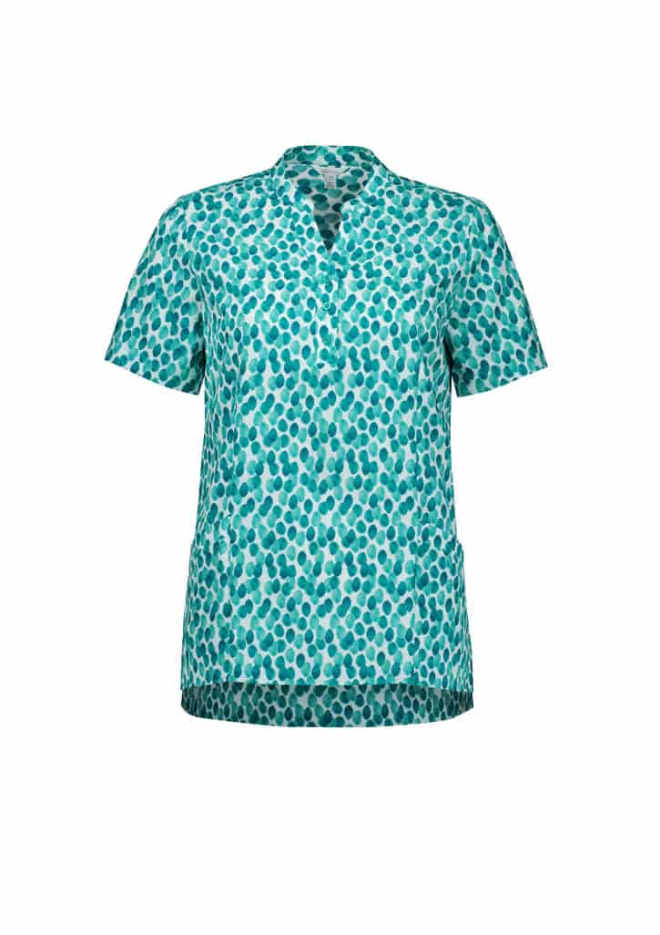 A short-sleeved tunic in a turquoise and white stardust print, featuring a V-neckline and side pockets.