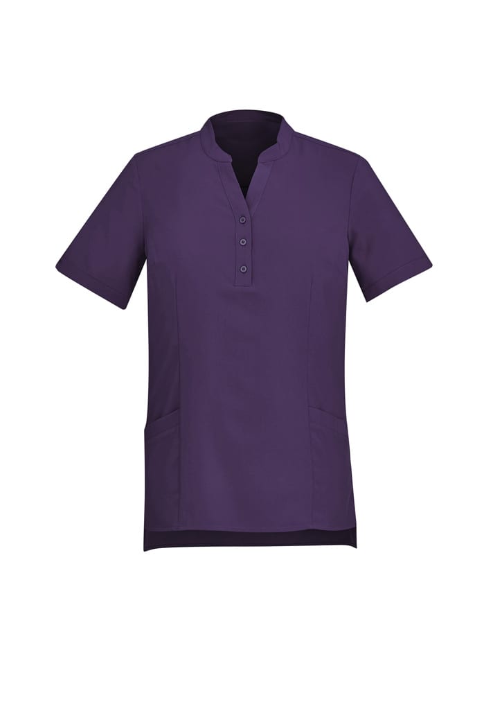 A purple women's tunic with short sleeves, a collar, and a buttoned placket, featuring side pockets and a logo.