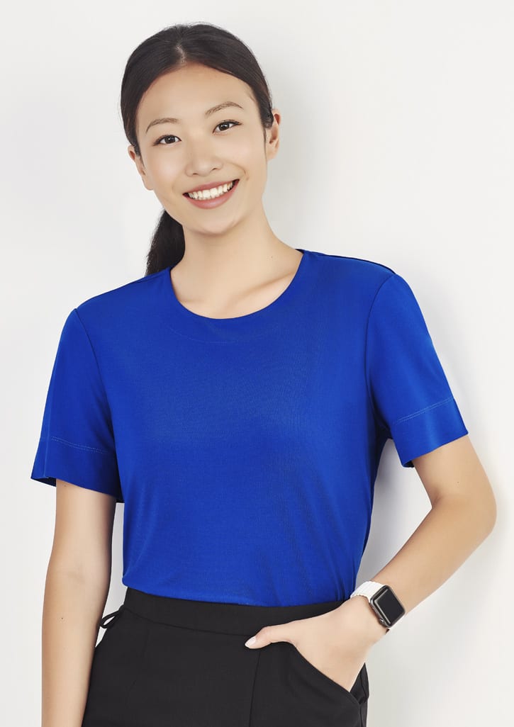 A women's short sleeve jersey top in bright blue, featuring a classic round neckline and a logo on the sleeve.