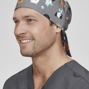 A unisex printed scrub cap in grey with various animal illustrations, featuring a tied back design.