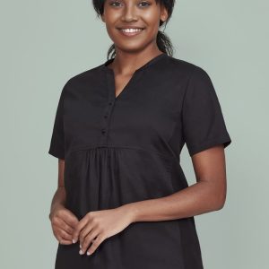 A black women's tunic scrub top with a buttoned front and a relaxed fit, featuring a logo.