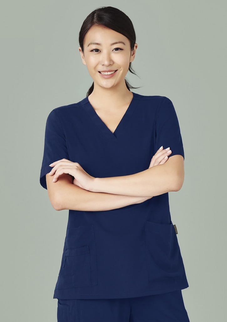 A women's navy V-neck scrub top with short sleeves and two front pockets, featuring a logo.