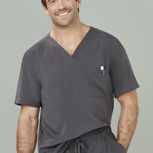 A man wearing a grey V-neck scrub top with a pocket. The scrub top features a loose fit and casual style.