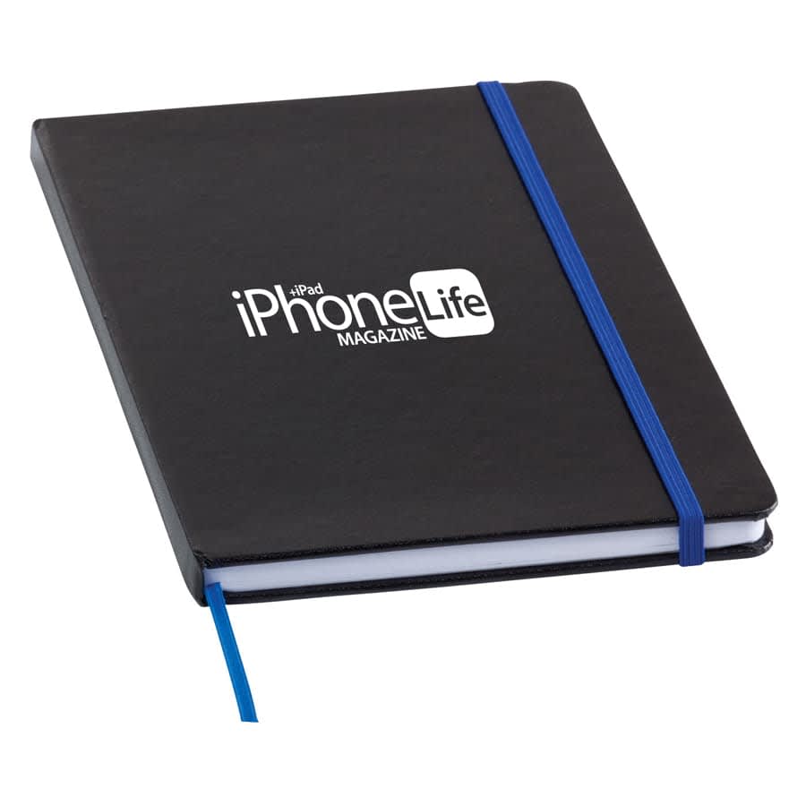 A black notebook with a blue elastic band, featuring a logo on the cover and a ribbon bookmark.