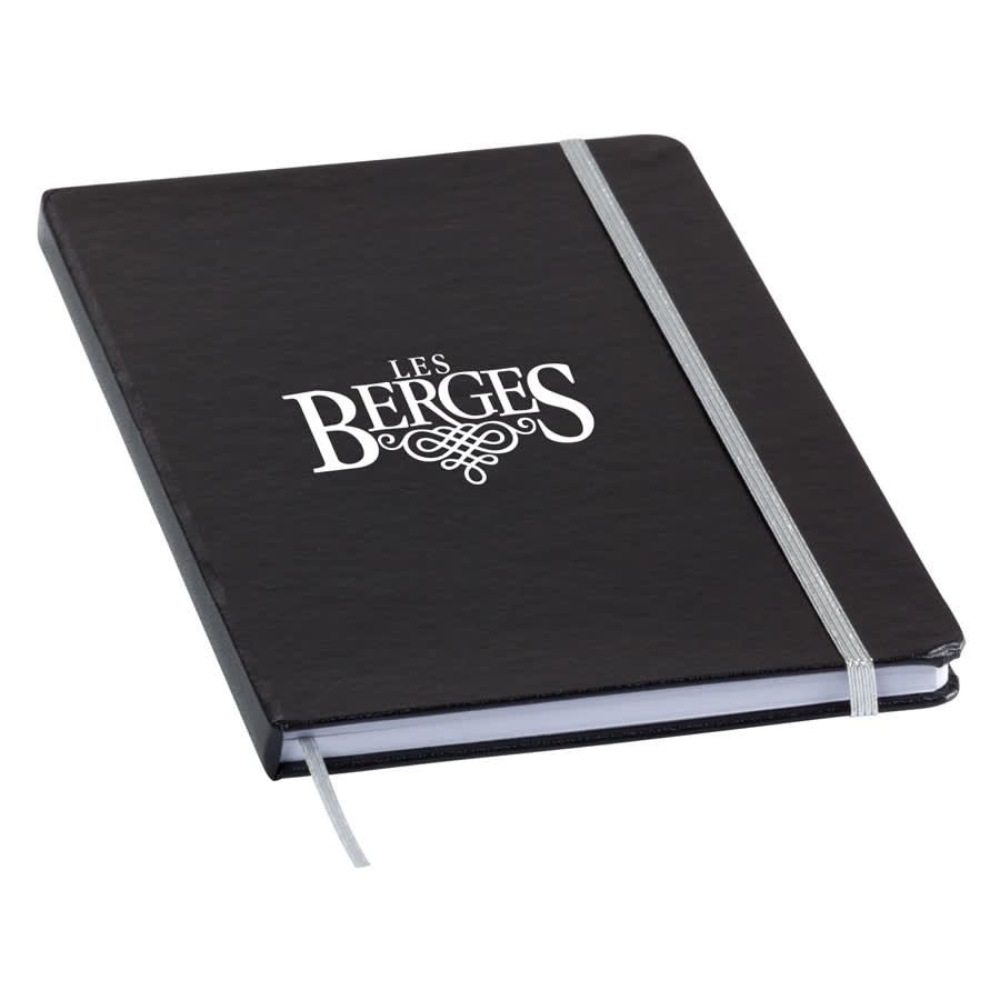 A black notebook with a silver elastic band and a logo on the cover.
