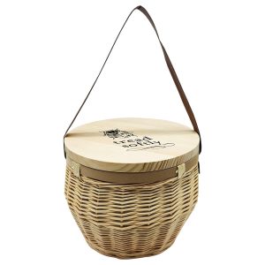 A wooden cooler basket with a circular lid, featuring a woven design and a brown strap for carrying.