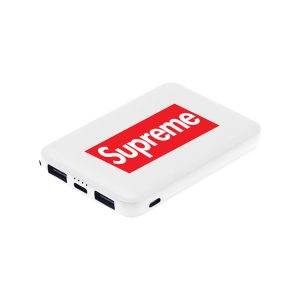 A white powerbank with a logo, featuring multiple ports for charging devices.