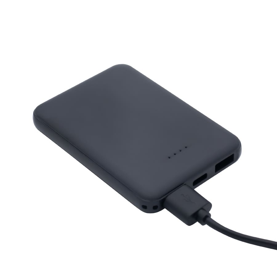 A black power bank with charging cable attached, featuring USB ports and indicator lights.