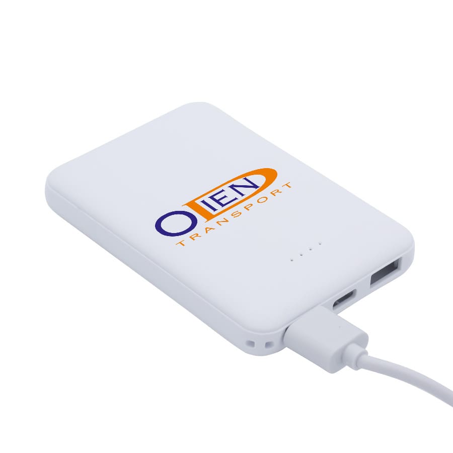 A white powerbank with a logo, featuring two USB ports and a charging cable connected.