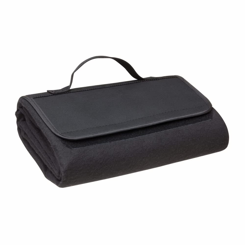 A black polar fleece picnic rug, neatly folded with a handle for easy transport. It features a textured surface.