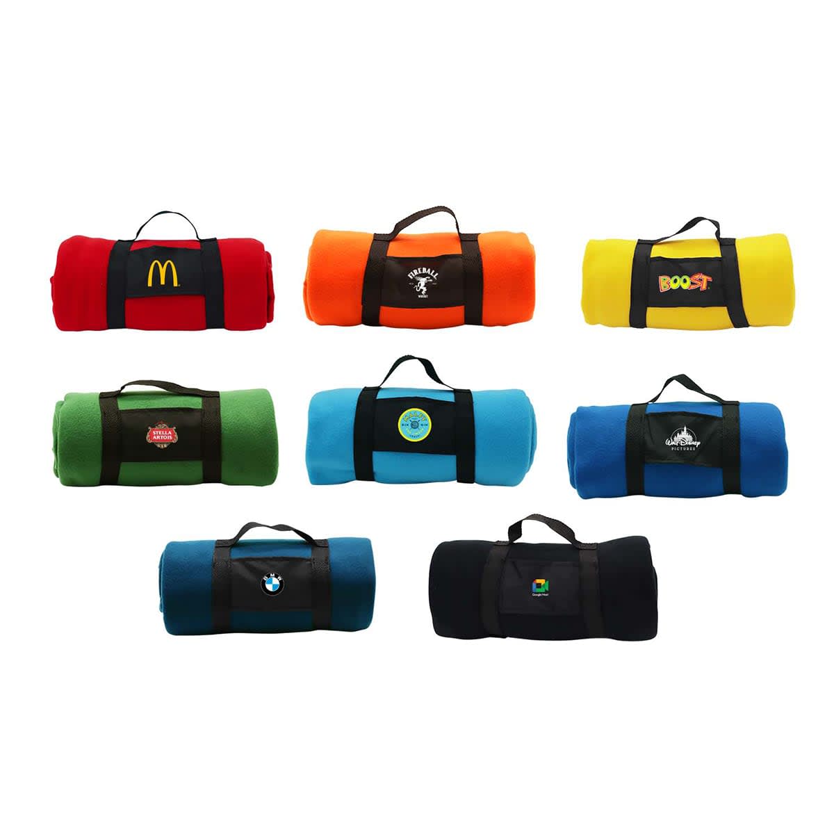 A collection of rolled-up blankets in various colours including red, orange, green, blue, and yellow, featuring different logos.