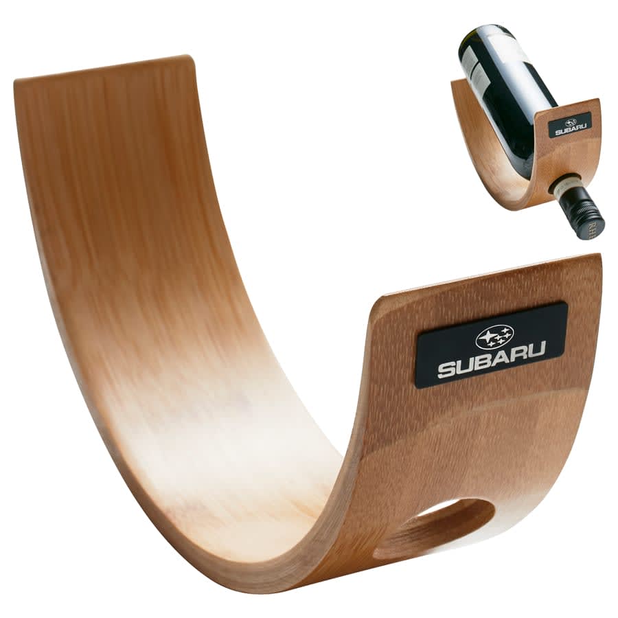 A curved wooden wine holder in a light brown finish, featuring a logo on one side.