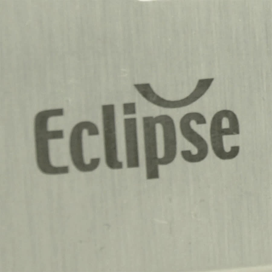 A close-up of a metallic surface featuring the word 