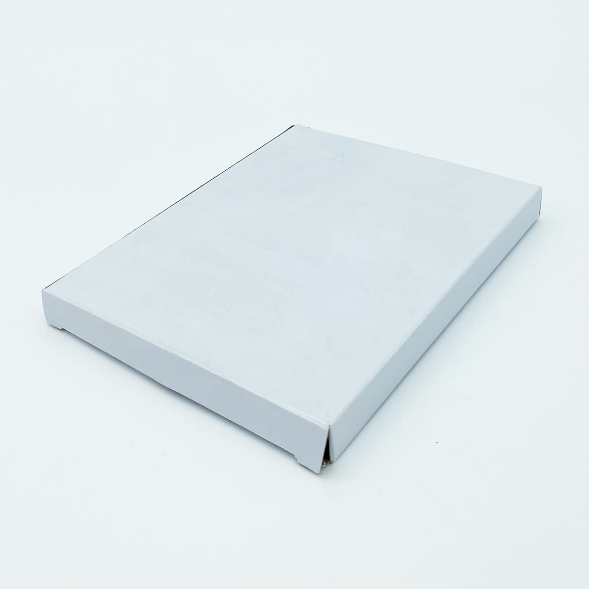 A white rectangular box with a flat lid, featuring a clean, minimalist design.