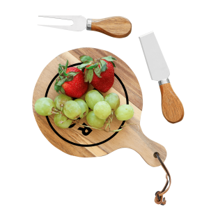 A wooden cheeseboard with a handle, featuring strawberries and grapes, accompanied by a cheese knife and fork.