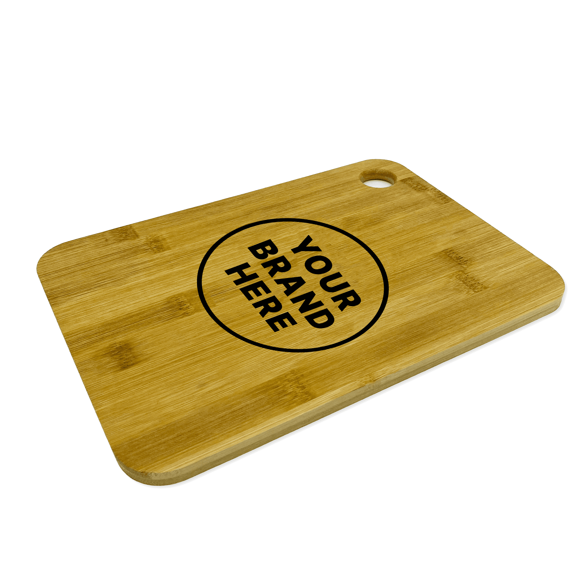 A large bamboo cutting board with a circular branding area and a hole for hanging. The surface is smooth and light brown.