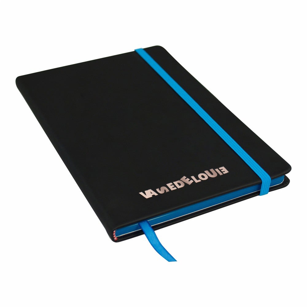 A black A5 journal with a blue elastic band and a ribbon bookmark, featuring a logo on the cover.