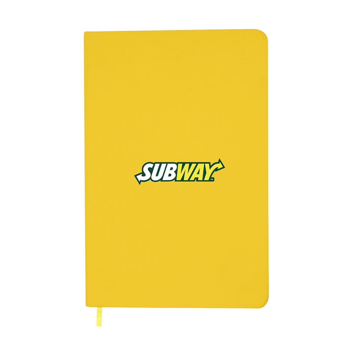 A yellow A5 notebook with a logo on the front and a ribbon bookmark attached.