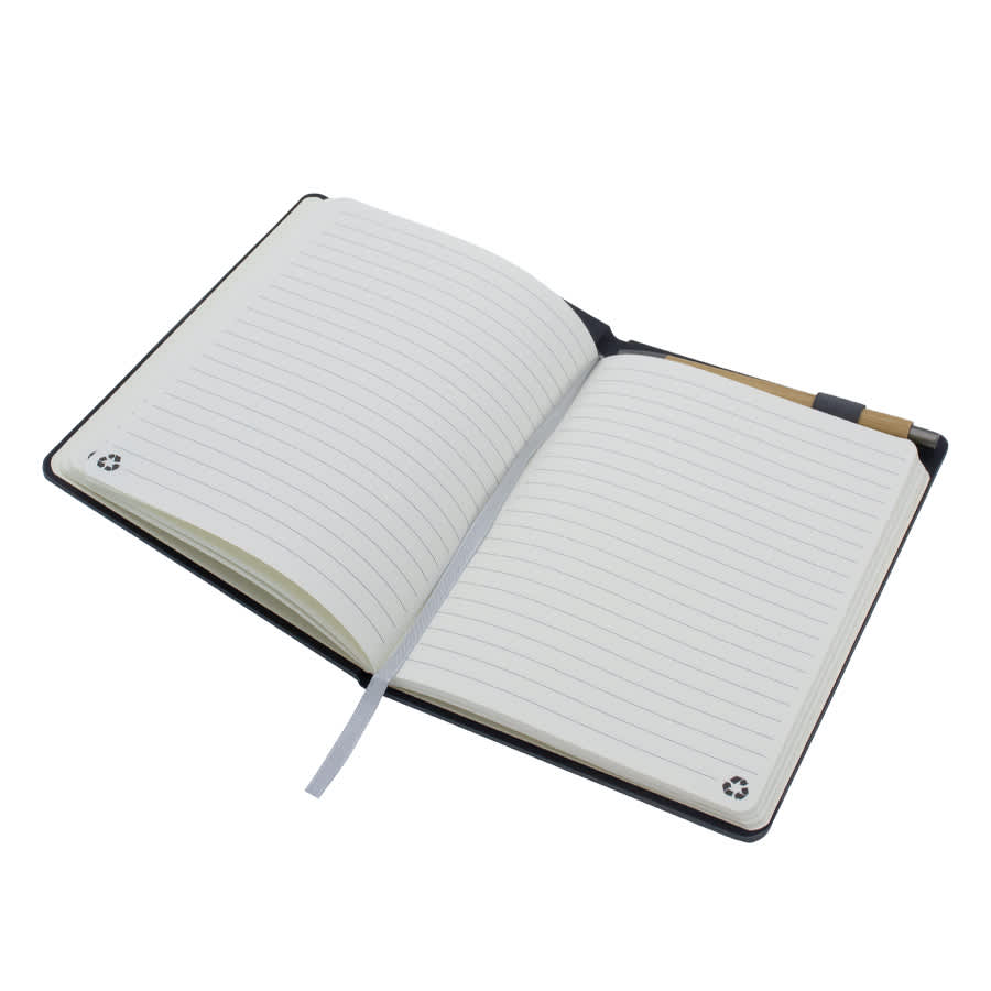 A black A5 notebook with lined pages, featuring a ribbon marker and a small logo on the cover.