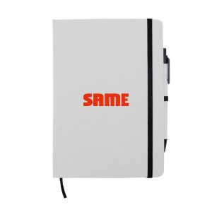 A white A5 notebook with a black strap and pen, featuring a logo on the cover.