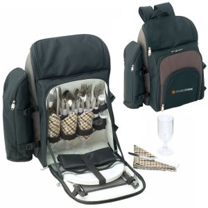 A black and grey picnic backpack with cutlery, plates, glasses, and napkins neatly arranged inside. It features a logo.