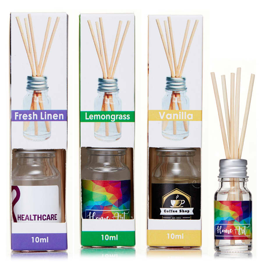 A set of three 10ml reed diffusers in various scents: Fresh Linen, Lemongrass, and Vanilla, in clear bottles with wooden reeds.