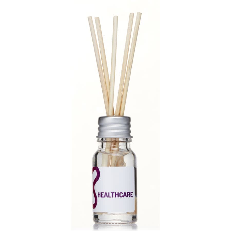A 10ml glass reed diffuser with a silver lid and bamboo reeds inside, featuring a white label and a logo.