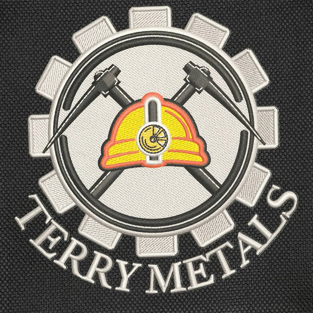 A dark textured background with a circular logo featuring a miner's helmet, crossed hammers, and the words 