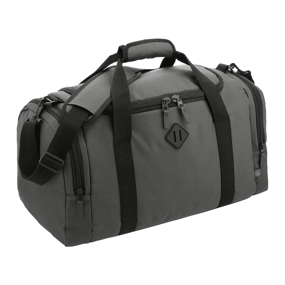 A black duffel bag made from recycled material, featuring a branding logo, resting on a blue patterned rug.