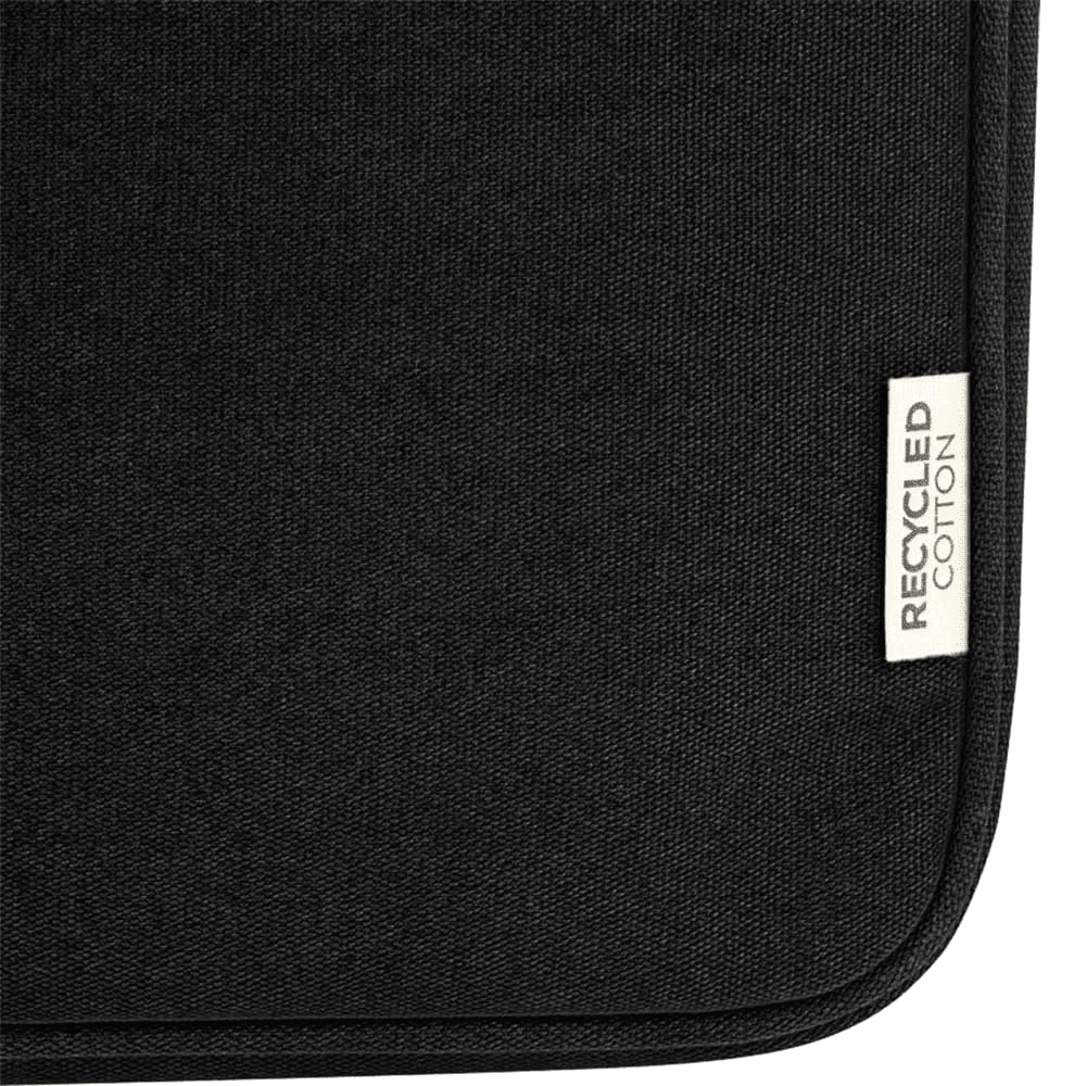 A dark navy recycled canvas laptop sleeve with a small tag indicating recycled cotton.