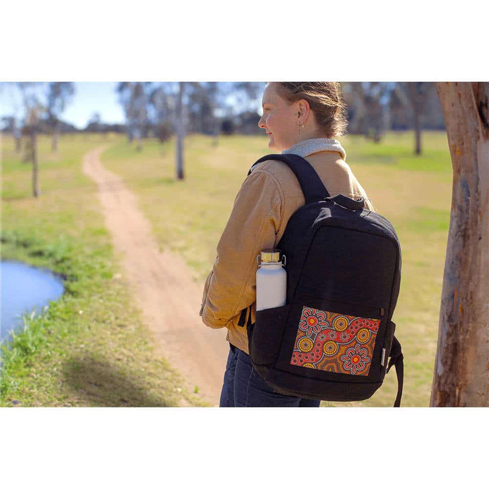 A black laptop backpack with a teal design featuring mountains and arrows, along with a logo.